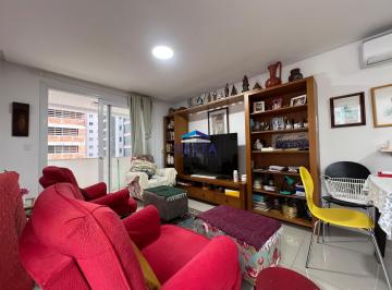 Sala de estar com sacada · Apartamento de 2 dormitórios com sacada a venda na Praia Grande em Torres RS