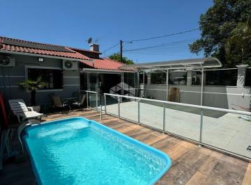 48819_iXw468oO5Oq3P_4881967f02ec1c16fa.jpg · Casa de esquina, com 2 quartos, 2 banheiros, 4 vagas de garagem e piscina no Central Park em Canoas