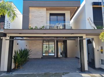 Foto 01 · Belissima residência de 3 suítes, piscina, gourmet e painel solar no Portal 3