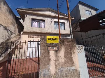 Photo 1 · Oportunidade para Investidores: Terreno com 2 Sobrados, Edícula e Vagas