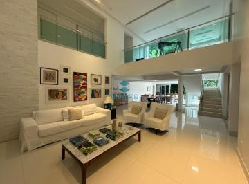 Sala com arte e sofisticação | Borges Realty · Casa à venda no Residencial Itapuã - Alphaville I, Salvador, com 355m², 4 quartos, 6 banheiros e 4 v
