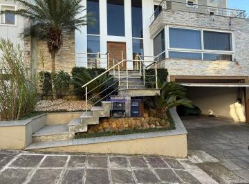 Foto 03 · Imóvel de luxo em Lomba do Pinheiro: Casa com 3 suítes, 3 salas e 6 vagas de garagem em Porto Alegre