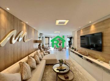 Sala · Apartamento à beira mar com 3 quartos (2 suítes) 2 vagas e lazer à venda em Pitangueiras, Guarujá