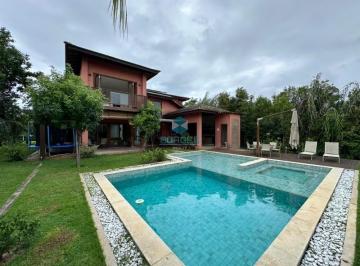 Piscina com design e spa integrado | Borges Realty · Casa alto padrão à venda no Condomínio Ilha dos Pássaros - Praia do Forte: 4 suítes, piscina, energi