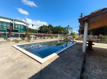 cbzmyzy2odm5zgm5njllowzm_md · Casa para locação comercial com piscina no Centro de Peruíbe