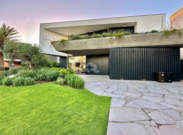 Casa · 346m² · 5 Quartos · 2 Vagas · Sobrado 5 suítes, sendo 3 térreas, mobiliada e decorada, com dependência, piscina aquecida no condom
