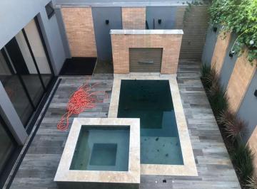 Foto 19 · Casa de luxo em condomínio Park Cambuí, Catanduva-SP: 4 quartos, 4 suítes, 3 vagas, 330m²!