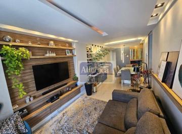 Sala Climatizada com rack e estante · Lindo apartamento 2 suítes em Icarai