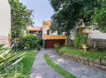 https:__pui.loft.com.br_listings_008fde51-3c49-42a4-a168-17134fd98ab9_photos_9abe3ead?preset=desktop · Casa à venda em Tristeza com 305 m², 5 quartos, 2 suítes, 5 vagas