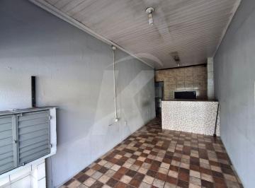 Comercial · 50m² · Salão comercial com banheiro e porta de aço.