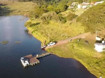 Casa · 120m² · 3 Quartos · 10 Vagas · Casa com piscina, terreno amplo e possibilidade de ampliação no Condomínio Porto Danalis - R$680 Mil