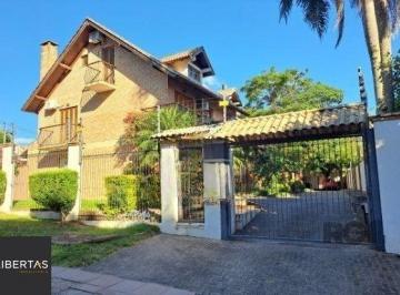 Casa · 268m² · 4 Quartos · 2 Vagas · Casa em condomínio em Ipanema de 3 dormitórios e 2 vagas
