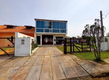 744536_i17auqFgqW9c2Tr12G_74453668cc1fbe5e80f.jpg · Sobrado no Centro de Xangri-Lá com amplo terreno de 450 metros quadrados e duas suítes