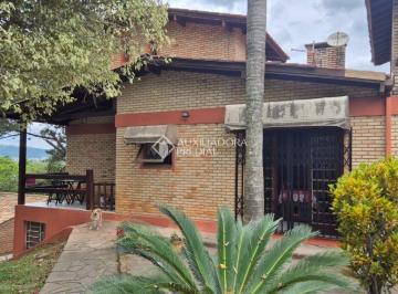 Casa · 470m² · 4 Quartos · 4 Vagas · Terreno de 1.242,79m² com duas casas integradas de tijolo á vista,