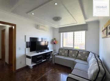 Living · Apartamento mobiliado de 71m², com 2 dormitórios, sendo 1 suíte e vaga no Centro