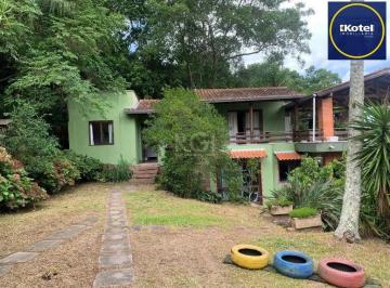 Casa · 200m² · 3 Quartos · 4 Vagas · Terreno de 5.280 m², com 3 casas, no bairro Ponta Grossa, em Porto Alegre.