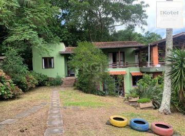 Casa · 200m² · 3 Quartos · 4 Vagas · Terreno de 5.280 m², com 3 casas, no bairro Ponta Grossa, em Porto Alegre.