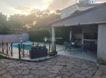 53da2c21-0b00-4a01-9166-904ea46da0a1 · Casa à venda no bairro Nonoai com 3 quartos, sendo 2 suítes e piscina