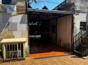 garagem · Salas comerciais e mais uma casa no Jd. Tupinambá.