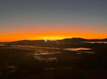 748722_ik5Sr773184K_74872268e6b7415249a.jpg · Terreno com vista deslumbrante da lagoa ao pôr do Sol