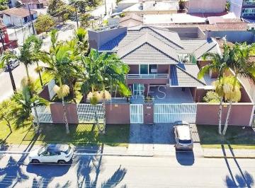 1 · Casa com 396.14 m², 4 quartos sendo 4 suítes à venda na Praia Brava de Caiobá.