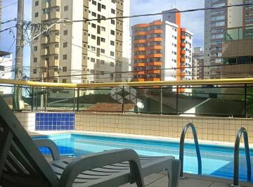 10 · Apartamento a venda na praia grande, aviação com 1 quarto e 1 vaga.
