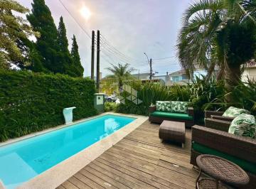 Apartamento · 300m² · 4 Quartos · Sobrado com 4 suítes mob/dec , área gourmet + piscina no condomínio fechado em Capão da Canoa