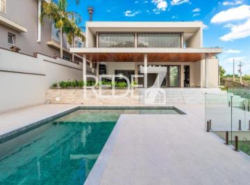 Piscina · Casa de alto padrão com 5 suítes e lazer completo em Residencial Jatibela, Campinas-SP: Luxo e sofis