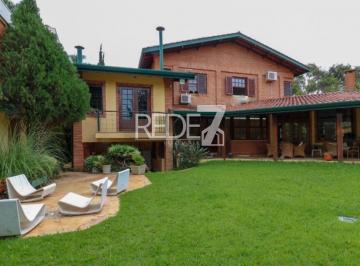 Foto 01 · Imperdível casa à venda em com 3 quartos, 1 suíte, 3 banheiros, 4 vagas de garagem e 374m² de área.