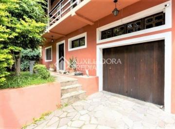 Casa · 280m² · 4 Quartos · 2 Vagas · Casa com 4 quartos, suíte e pátio com piscina à venda no bairro Tristeza