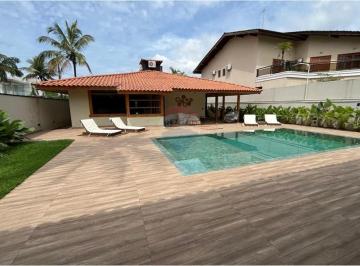 Casa · 224m² · 4 Quartos · 2 Vagas · Luxo à Beira-mar: Casa de Alto Padrão no Guarujá