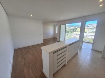 Imagem da cozinha integrada com a sala · Apartamento em andar alto com 94 m², 2 dormitórios sendo 1 suíte e 2 vagas.