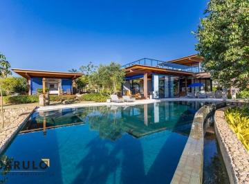 Borda infinita da piscina e comunicação visual com o paisagismo · Casa com 6 suítes à venda, 1162 m² por R$ 32.000.000 - Condominio Fazenda Boa Vista - Porto Feliz/SP