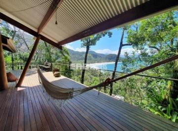 Casa · 700m² · 3 Quartos · 2 Vagas · Casa com vista cinematográfica na praia do Félix, com 3 dormitórios