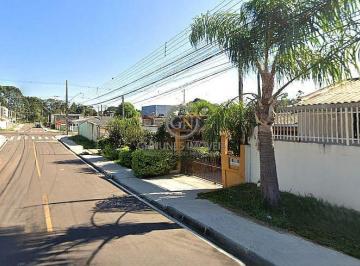 Fachada do terreno à venda na Rua Paraíba, Bairro Iguaçu, Araucária. Terreno limpo e pronto para construir, com pavimentação e iluminação pública. · Terreno ZR2 em Araucária - 12 Pavimentos no Bairro Iguaçu