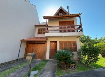 Casa · 206m² · 4 Quartos · 2 Vagas · Residência com 4 dormitórios em condomínio no Bairro Guarujá com Energia Solar Privativa.