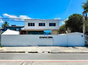 e484e3d3496c15ba2dd19cba0618b0078f13c90a · Casa frente mar à venda na praia da Enseada no Guarujá I Omega Imoveis