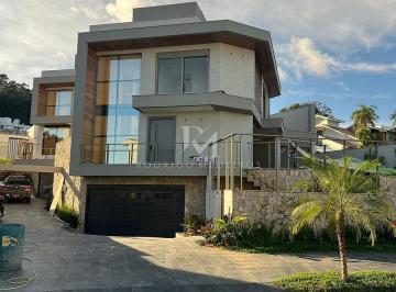 whatsapp-image-2026-03-07-at-175544-17731502184146.jpeg · Casa nova com 4 suítes e vista mar no Cacupé, Florianópolis-SC