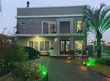 Casa · 400m² · 4 Quartos · 4 Vagas · Casa sobrado no Condomínio Golden River em Imbé com 4 dormitórios