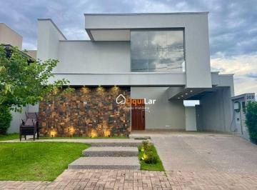 f4bb45b73b0feea9561884254835782b3315fbcd · Casa Térrea de Alto Padrão no Alphaville IV com 3 Suítes, Piscina Aquecida e Pé-Direito Duplo