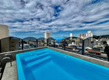 1b82519ddb7044558f80763d7cdf5ed31da45fb1 · Cobertura à venda na praia da Enseada em Guarujá | Ômega Imóveis