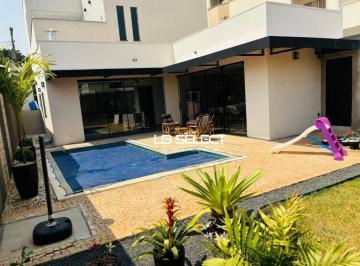 9b9a50b2075896427405f41839e9a69bae212f4f · Casa no bairro Daniel Fonseca, com três quartos, piscina e varanda gourmet completa