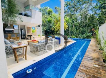 72d24e33c80c0ce72c0a30f5c9b00b60e556fd5f · Casa contemporânea cercada pela natureza no Módulo 24 | Piscina aquecida e garagem subterrânea