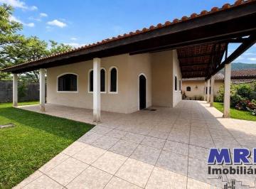Foto 01 · Casa em Ubatuba com 4 dormitórios sendo 2 suítes e 1 com banheira com hidro, área verde e edícula no