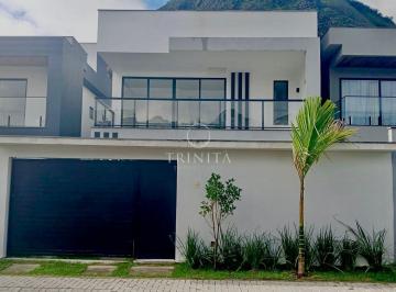 Fachada · Casa moderna com 4 suítes em condomínio fechado.