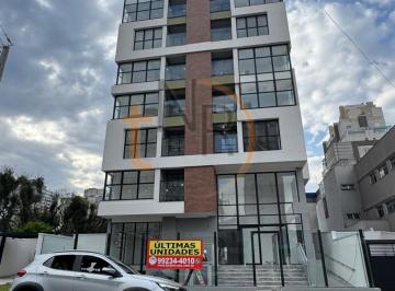 Foto 1 · Apartamento de um dormitório com sacada com churrasqueira