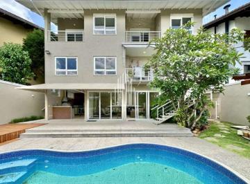 Casa · 450m² · 4 Quartos · 6 Vagas · Residência de Alto Padrão em Condomínio - 4 Suítes, Vista Moderna e Piscina!