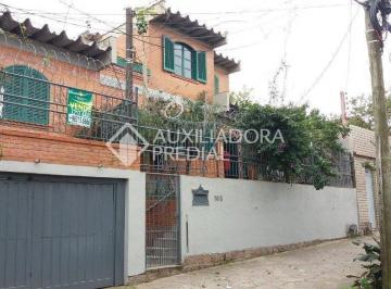 01 · Casa, estilo sobrado de 4 quartos, no bairro Medianeira, 2 vagas de garagem, churrasqueira