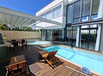 Casa · 380m² · 5 Quartos · 3 Vagas · Auxiliadora Predial aluga encantadora casa no bairro Jurerê Internacional, em Florianópolis.
