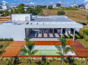 Foto 01 · Casa térrea à venda no Condomínio Campos de Santo Antônio II com 335m² e 4 súites